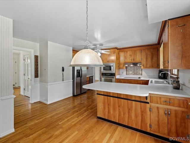 2340 Scarsborough Dr, North Chesterfield, VA 23235 - kitchen featuring appliances with stainless steel finishes, brown cabinetry, light countertops, and light wood-type flooring