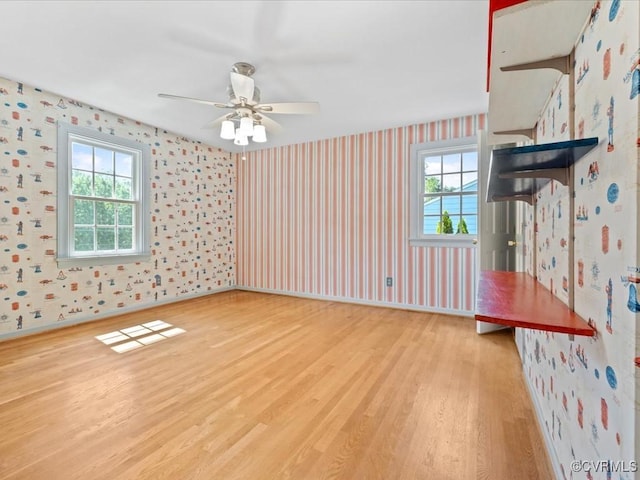 2340 Scarsborough Dr, North Chesterfield, VA 23235 - spare room with wallpapered walls, wood finished floors, and ceiling fan