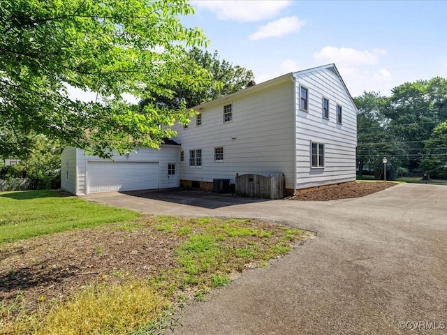2340 Scarsborough Dr, North Chesterfield, VA 23235 - view of side of property with driveway and a garage
