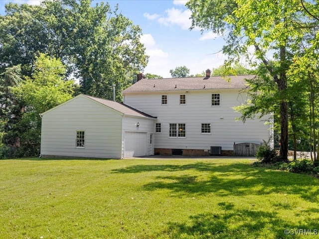 2340 Scarsborough Dr, North Chesterfield, VA 23235 - rear view of property with a garage, a lawn, and a chimney