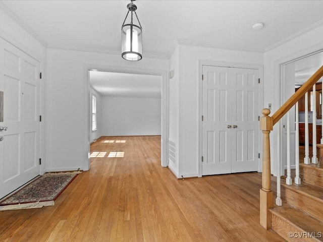 2340 Scarsborough Dr, North Chesterfield, VA 23235 - foyer entrance featuring light wood finished floors, ornamental molding, and stairway