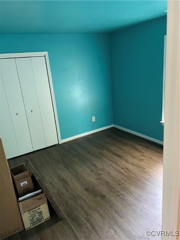 10904 Robin Spring Ln, Glen Allen, VA 23060 - unfurnished bedroom featuring wood finished floors and a closet