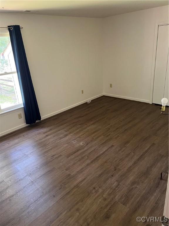 10904 Robin Spring Ln, Glen Allen, VA 23060 - unfurnished room with dark wood-type flooring and baseboards
