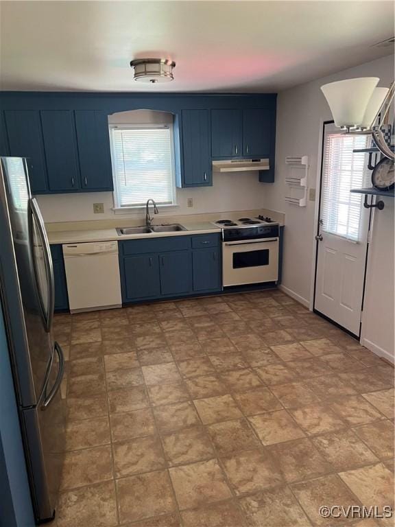 10904 Robin Spring Ln, Glen Allen, VA 23060 - kitchen with white appliances, under cabinet range hood, blue cabinetry, and light countertops