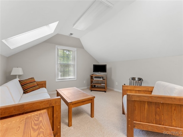 2730 Dalkeith Dr, Henrico, VA 23233 - living area featuring a skylight, light colored carpet, and vaulted ceiling