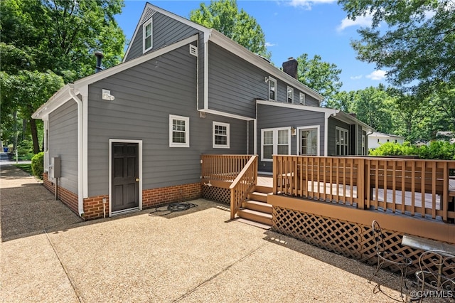 2730 Dalkeith Dr, Henrico, VA 23233 - rear view of property with a chimney, a wooden deck, and a patio