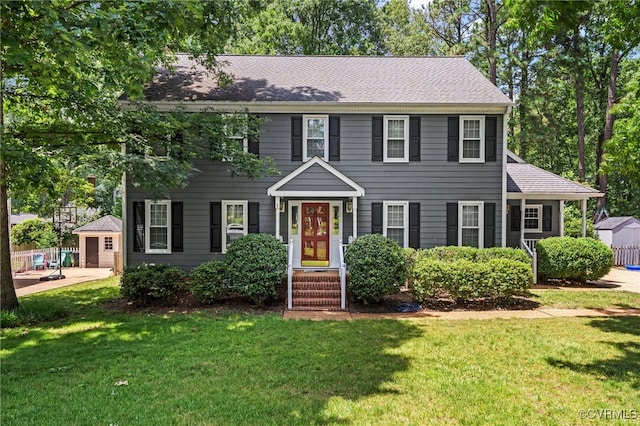 2730 Dalkeith Dr, Henrico, VA 23233 - colonial home with an outdoor structure, a front lawn, and roof with shingles