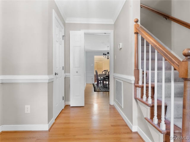 2730 Dalkeith Dr, Henrico, VA 23233 - hallway with light wood-type flooring, stairs, crown molding, and a chandelier