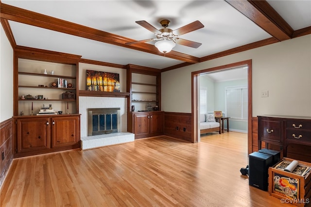 2730 Dalkeith Dr, Henrico, VA 23233 - living room with light wood finished floors, a brick fireplace, crown molding, a ceiling fan, and a wainscoted wall