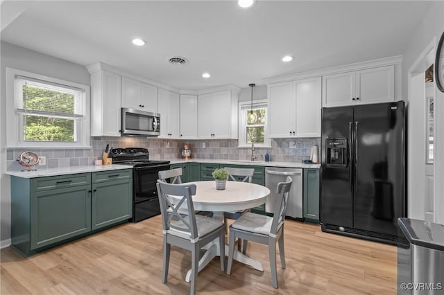 611 Queensway Rd, North Chesterfield, VA 23236 - kitchen featuring black appliances, green cabinets, light countertops, white cabinetry, and recessed lighting