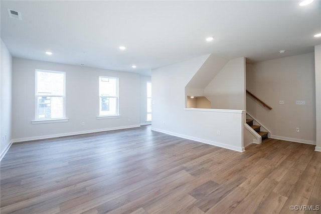3446 Carlton St Unit 6-13A, Richmond, VA 23230 - unfurnished living room with light wood-style flooring, stairs, and recessed lighting