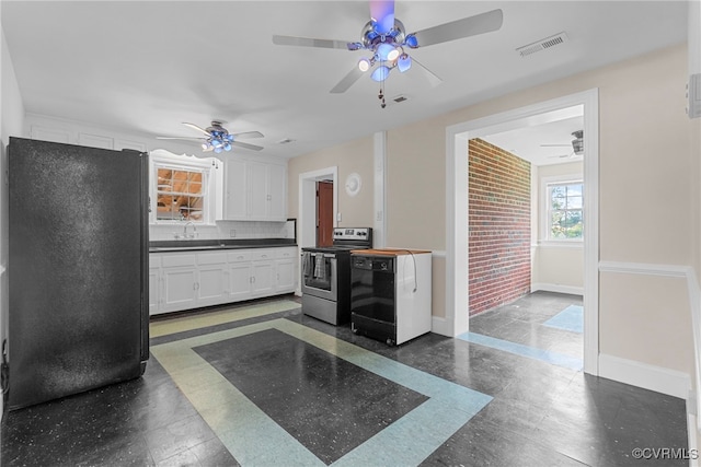 501 E Azalea Ave, Richmond, VA 23227 - kitchen with stainless steel electric range, freestanding refrigerator, a ceiling fan, white cabinets, and dark countertops