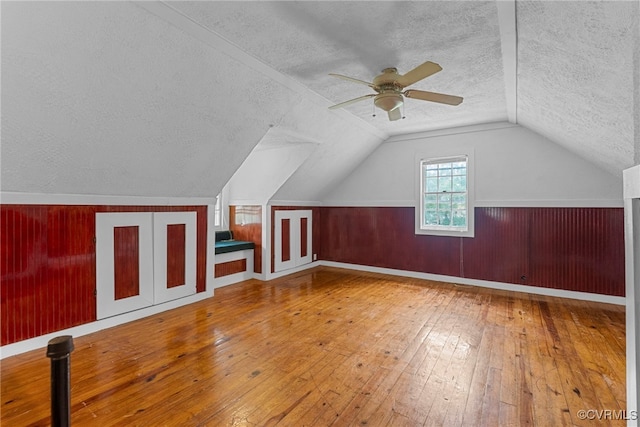 501 E Azalea Ave, Richmond, VA 23227 - bonus room with a textured ceiling, a ceiling fan, hardwood / wood-style flooring, lofted ceiling, and a wainscoted wall