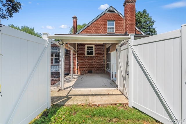 501 E Azalea Ave, Richmond, VA 23227 - rear view of property with brick siding, a patio area, and a chimney
