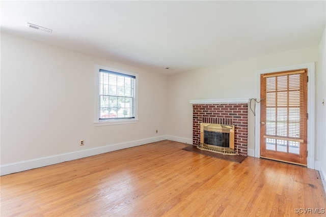 501 E Azalea Ave, Richmond, VA 23227 - unfurnished living room featuring a fireplace and wood finished floors