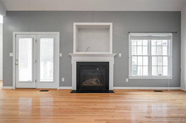 17220 Dawn Ct, Amelia Courthouse, VA 23002 - unfurnished living room with wood finished floors and a fireplace with flush hearth