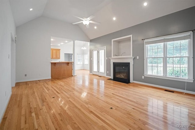 17220 Dawn Ct, Amelia Courthouse, VA 23002 - unfurnished living room with light wood-style floors, a ceiling fan, a fireplace with flush hearth, lofted ceiling, and recessed lighting