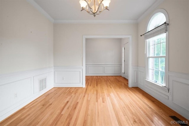 17220 Dawn Ct, Amelia Courthouse, VA 23002 - spare room with a chandelier, light wood-type flooring, wainscoting, and ornamental molding