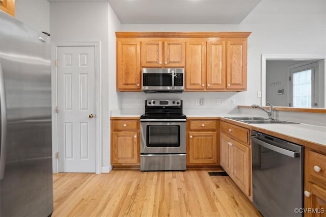 17220 Dawn Ct, Amelia Courthouse, VA 23002 - kitchen featuring appliances with stainless steel finishes, light wood finished floors, and light countertops