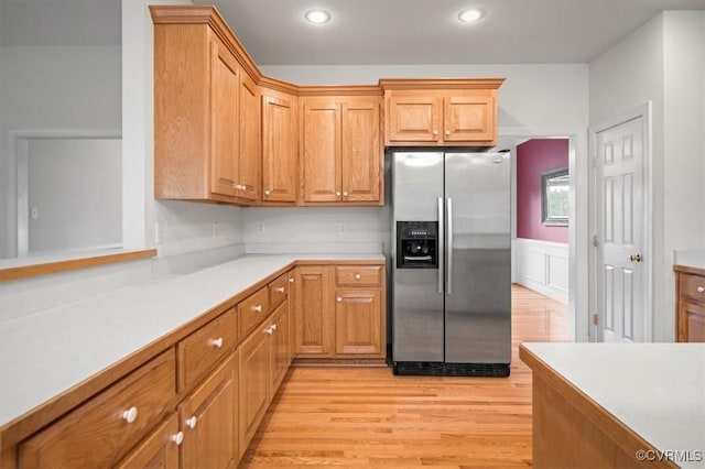 17220 Dawn Ct, Amelia Courthouse, VA 23002 - kitchen with stainless steel fridge with ice dispenser, light wood finished floors, light countertops, recessed lighting, and a wainscoted wall