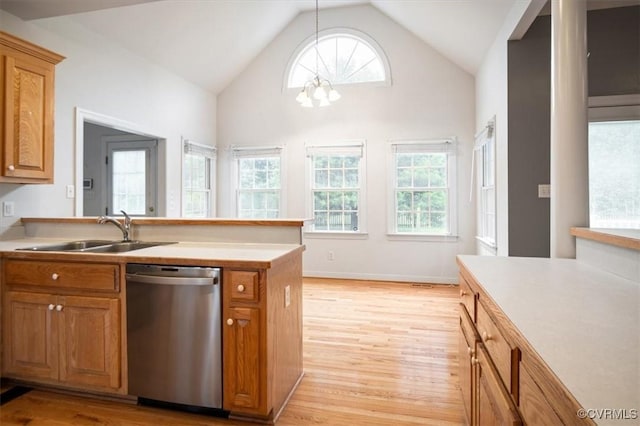 17220 Dawn Ct, Amelia Courthouse, VA 23002 - kitchen with stainless steel dishwasher, brown cabinetry, light wood-style floors, and high vaulted ceiling