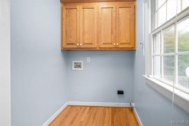 17220 Dawn Ct, Amelia Courthouse, VA 23002 - washroom with washer hookup, cabinet space, electric dryer hookup, and light wood-style flooring