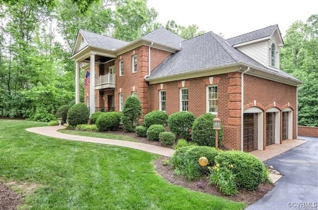 1638 Fallen Timber Trl, Powhatan, VA 23139 - view of front of property featuring brick siding, asphalt driveway, a front lawn, and an attached garage