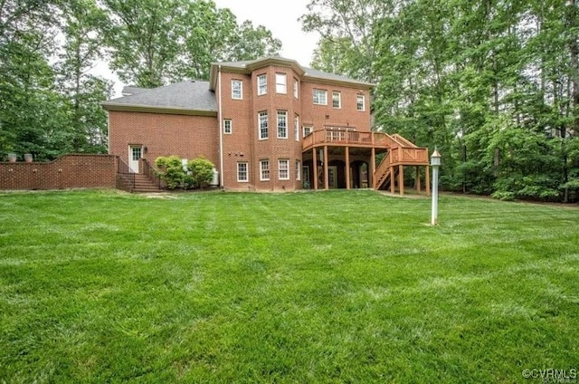1638 Fallen Timber Trl, Powhatan, VA 23139 - back of property featuring stairs, a yard, a deck, and brick siding