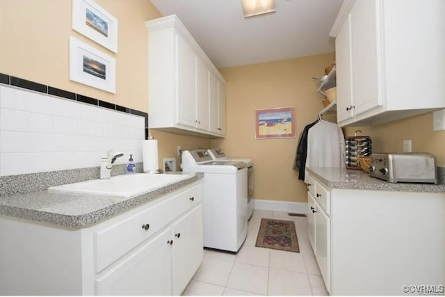 1638 Fallen Timber Trl, Powhatan, VA 23139 - laundry area featuring cabinet space, washer and clothes dryer, and light tile patterned floors