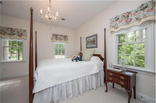 1638 Fallen Timber Trl, Powhatan, VA 23139 - carpeted bedroom featuring a chandelier and baseboards