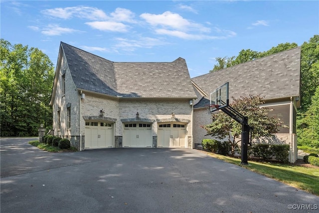 923 Merchant Lee Pl, Manakin Sabot, VA 23103 - view of side of property featuring an attached garage, driveway, and stone siding
