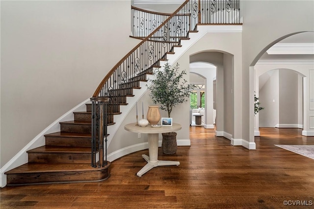 923 Merchant Lee Pl, Manakin Sabot, VA 23103 - stairway featuring wood finished floors, a high ceiling, and arched walkways