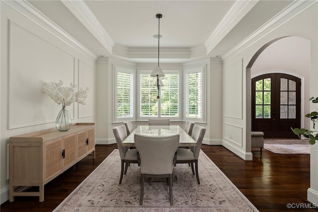 923 Merchant Lee Pl, Manakin Sabot, VA 23103 - dining area with arched walkways, a raised ceiling, dark wood-style floors, and ornamental molding