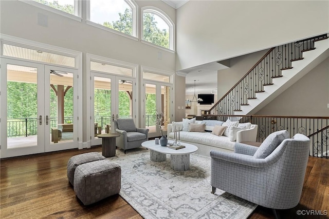 923 Merchant Lee Pl, Manakin Sabot, VA 23103 - living room with french doors, a towering ceiling, dark wood-type flooring, a ceiling fan, and stairs
