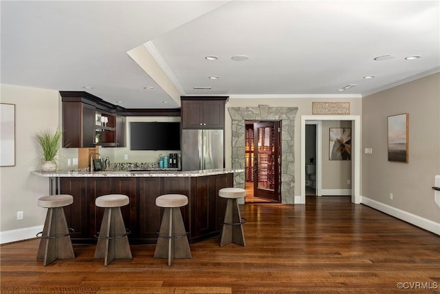 923 Merchant Lee Pl, Manakin Sabot, VA 23103 - kitchen featuring freestanding refrigerator, crown molding, a peninsula, dark wood-style flooring, and dark brown cabinetry