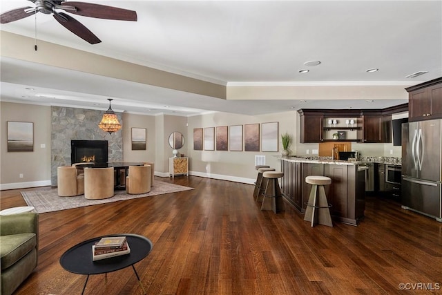 923 Merchant Lee Pl, Manakin Sabot, VA 23103 - living room featuring ornamental molding, ceiling fan, dark wood-style flooring, a fireplace, and recessed lighting
