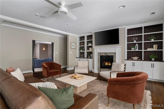923 Merchant Lee Pl, Manakin Sabot, VA 23103 - living room featuring crown molding, dark wood-type flooring, ceiling fan, a premium fireplace, and recessed lighting