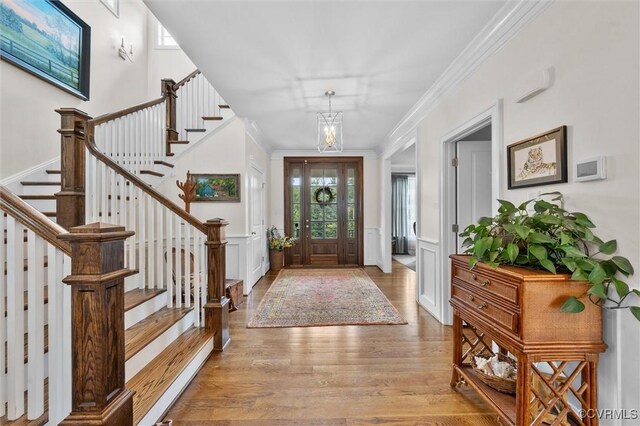 5154 Lake Summer Loop, Moseley, VA 23120 - entrance foyer with stairs, wood finished floors, ornamental molding, a decorative wall, and wainscoting