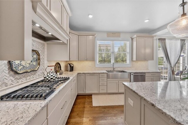 5154 Lake Summer Loop, Moseley, VA 23120 - kitchen featuring stainless steel appliances, premium range hood, wood finished floors, decorative backsplash, and light stone counters