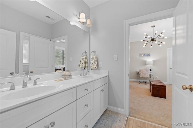 5154 Lake Summer Loop, Moseley, VA 23120 - bathroom with double vanity and a chandelier