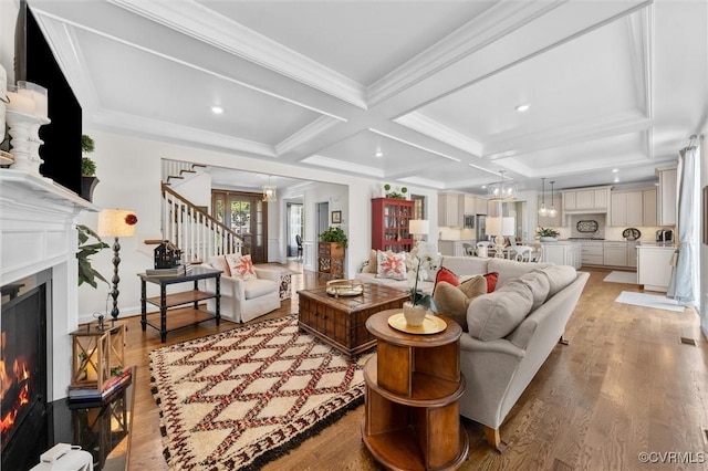 5154 Lake Summer Loop, Moseley, VA 23120 - living area featuring a lit fireplace, coffered ceiling, light wood-style floors, stairs, and beam ceiling