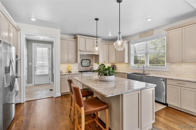 5154 Lake Summer Loop, Moseley, VA 23120 - kitchen featuring appliances with stainless steel finishes, recessed lighting, a center island, wood finished floors, and tasteful backsplash