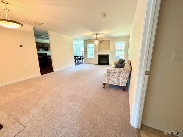 4000 Rotherham Cir, Prince George, VA 23875 - carpeted living area featuring a ceiling fan and a fireplace