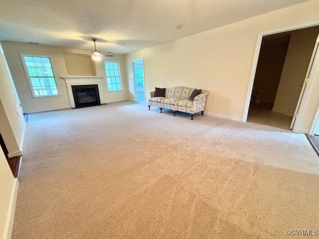 4000 Rotherham Cir, Prince George, VA 23875 - living area with ceiling fan, carpet floors, and a fireplace with flush hearth
