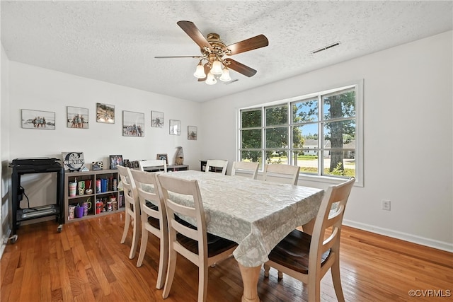 1593 Baxter Rd, Prince George, VA 23875 - dining room with wood finished floors, a textured ceiling, and ceiling fan