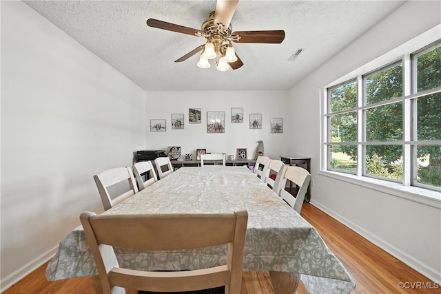 1593 Baxter Rd, Prince George, VA 23875 - dining area featuring a textured ceiling, wood finished floors, and ceiling fan