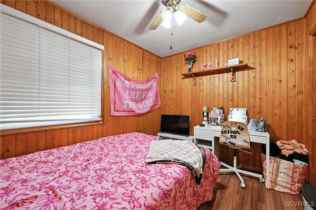 1593 Baxter Rd, Prince George, VA 23875 - bedroom with wood finished floors, wood walls, and ceiling fan