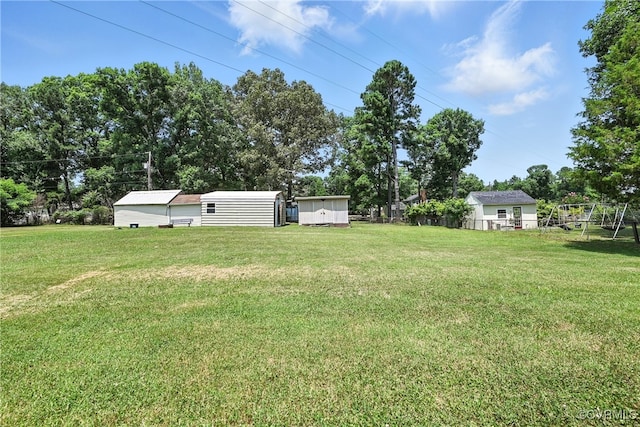 1593 Baxter Rd, Prince George, VA 23875 - view of grassy yard with a storage unit and view of wooded area