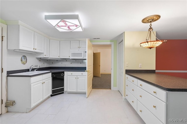 4410 Sharonridge Dr, North Chesterfield, VA 23236 - kitchen featuring dishwasher, white microwave, dark countertops, white cabinets, and a peninsula