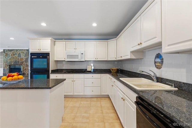 4410 Sharonridge Dr, North Chesterfield, VA 23236 - kitchen with black appliances, white cabinetry, backsplash, and recessed lighting